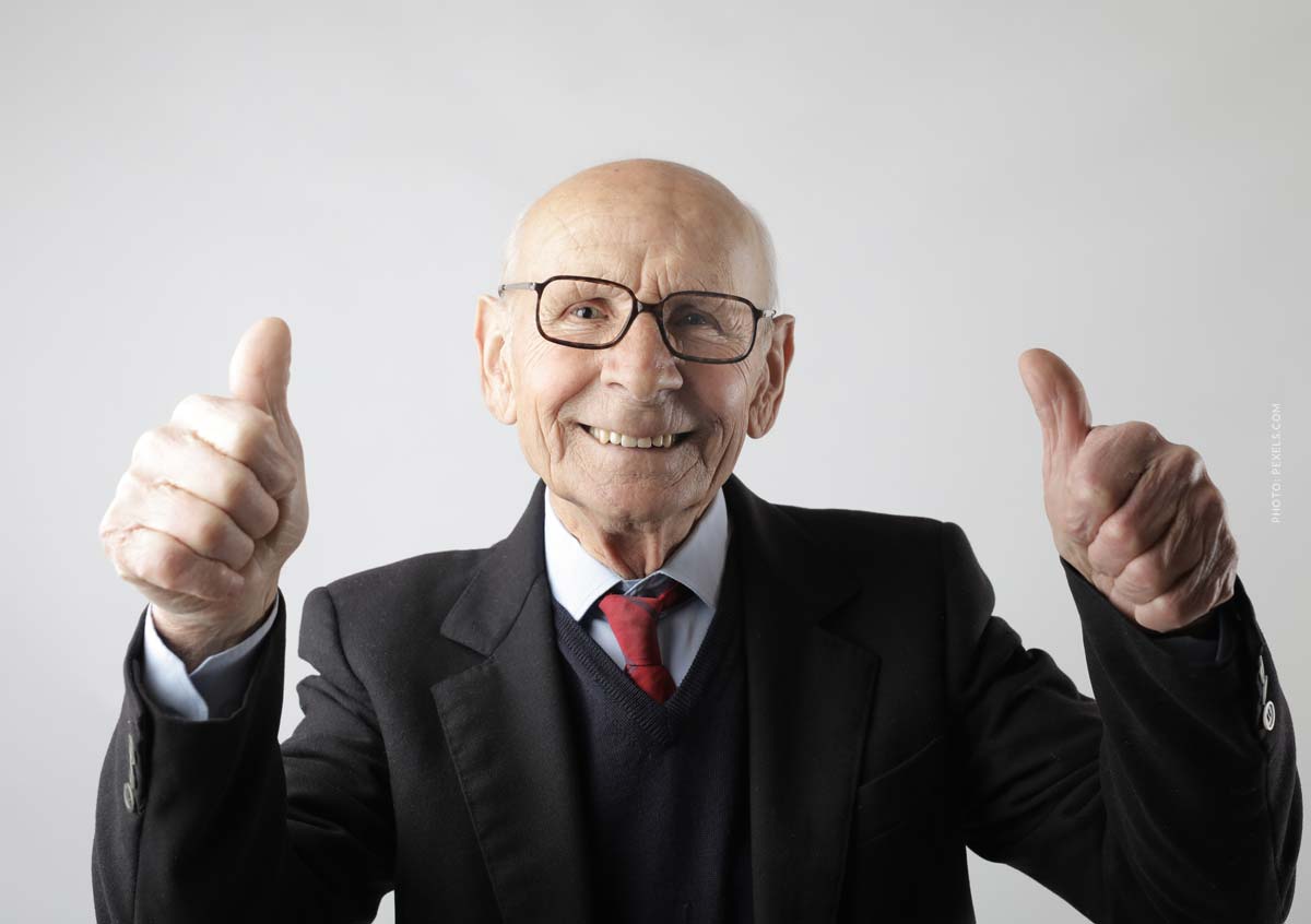 net-promotor-score-definition-customer-satisfaction-man-thumbs-up-glasses-suit